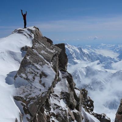 Stand on top of a mountain