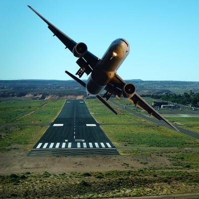 Pilot a plane taking off from a runway