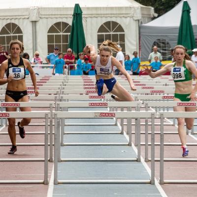 Compete in a track and field meet