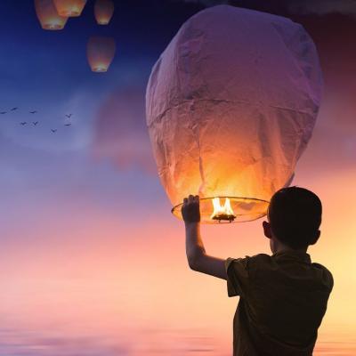 Light a sky lantern into the night sky