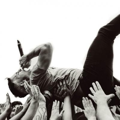 Crowd surf while singing