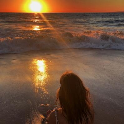 Watch the sun set over the sea