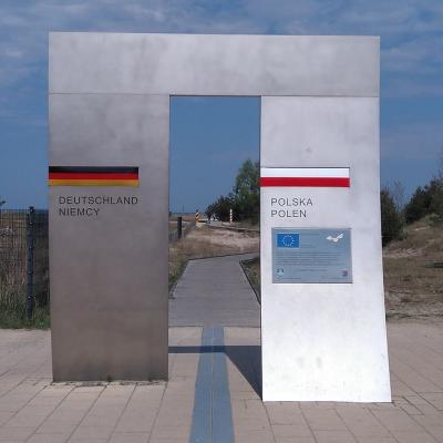 Stand on the border of two countries with one foot in each