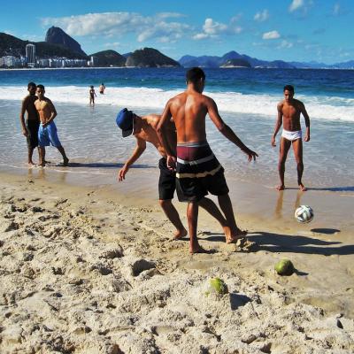 Play football on Copacabana beach