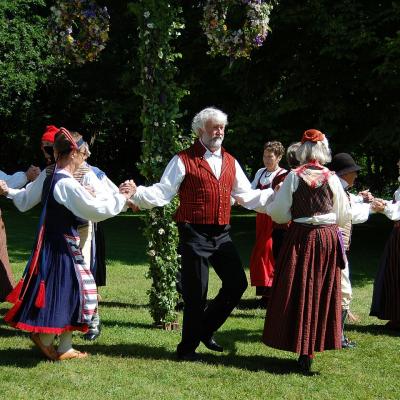 Take part in a folk dance