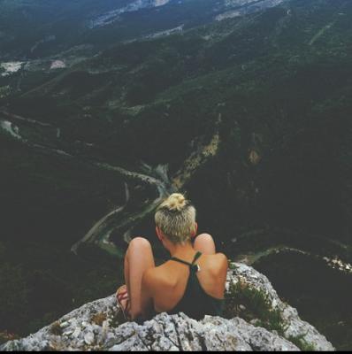 Sit at the edge of a cliff