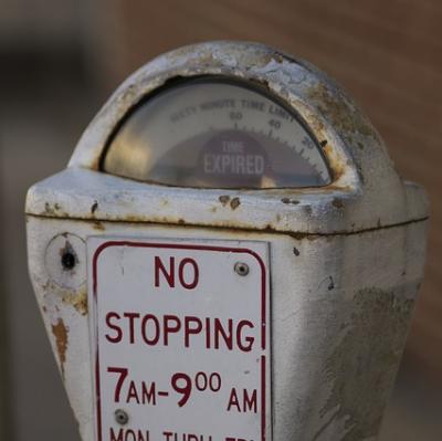 Put money into a stranger's parking meter