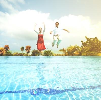 Jump into a pool fully clothed