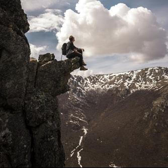 Sit on a cliff overhang