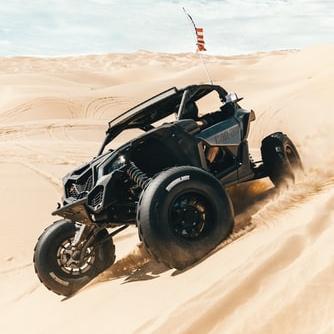 Drive a dune buggy in the desert
