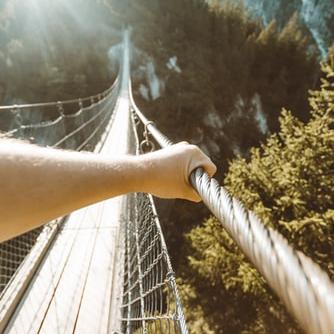 Cross a rope bridge