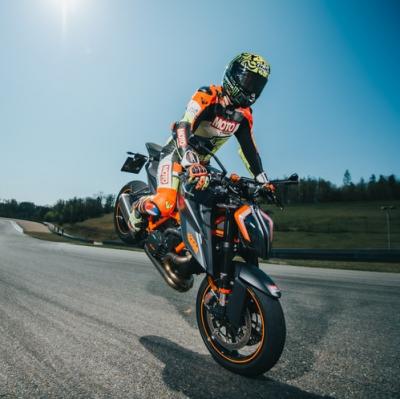 Perform a motorcycle trick