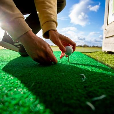 Hit 100 balls at a driving range