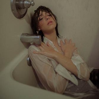 Sit in a bath fully clothed