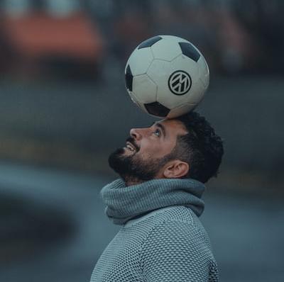 Balance a football on my head for 100 seconds