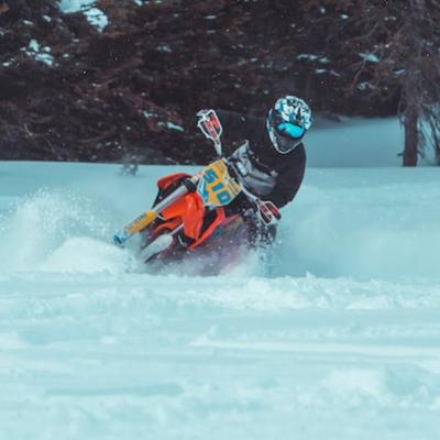 Ride a dirt bike through snow