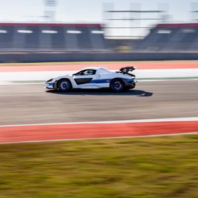 Drive a sports car on a race track