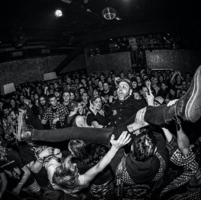 Crowd-surf at a concert