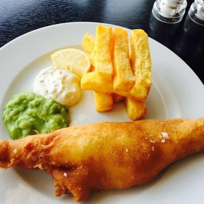 Eat fish and chips in the UK