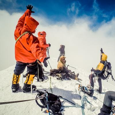 Climb to the top of a snow capped mountain