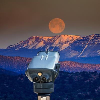 Look at the moon through a telescope